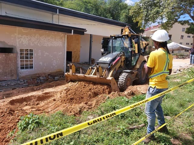 A Jamaal’s Industrial crew and CAT backhoe excavating on site